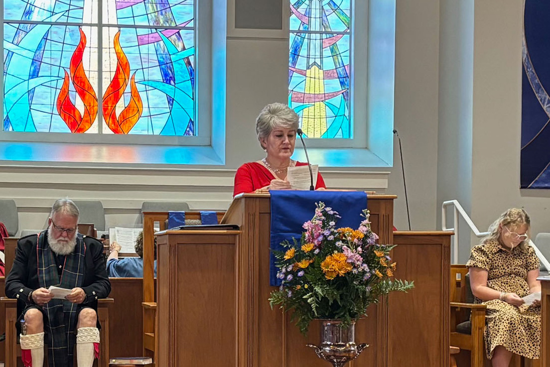  Elder leading worship at Sea Island Presbyterian Church.